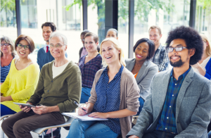 group sitting through benefits presentation