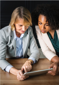 managers reviewing employee benefits videos